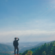 Man Looking From a Cliff at Mountains and Horizon